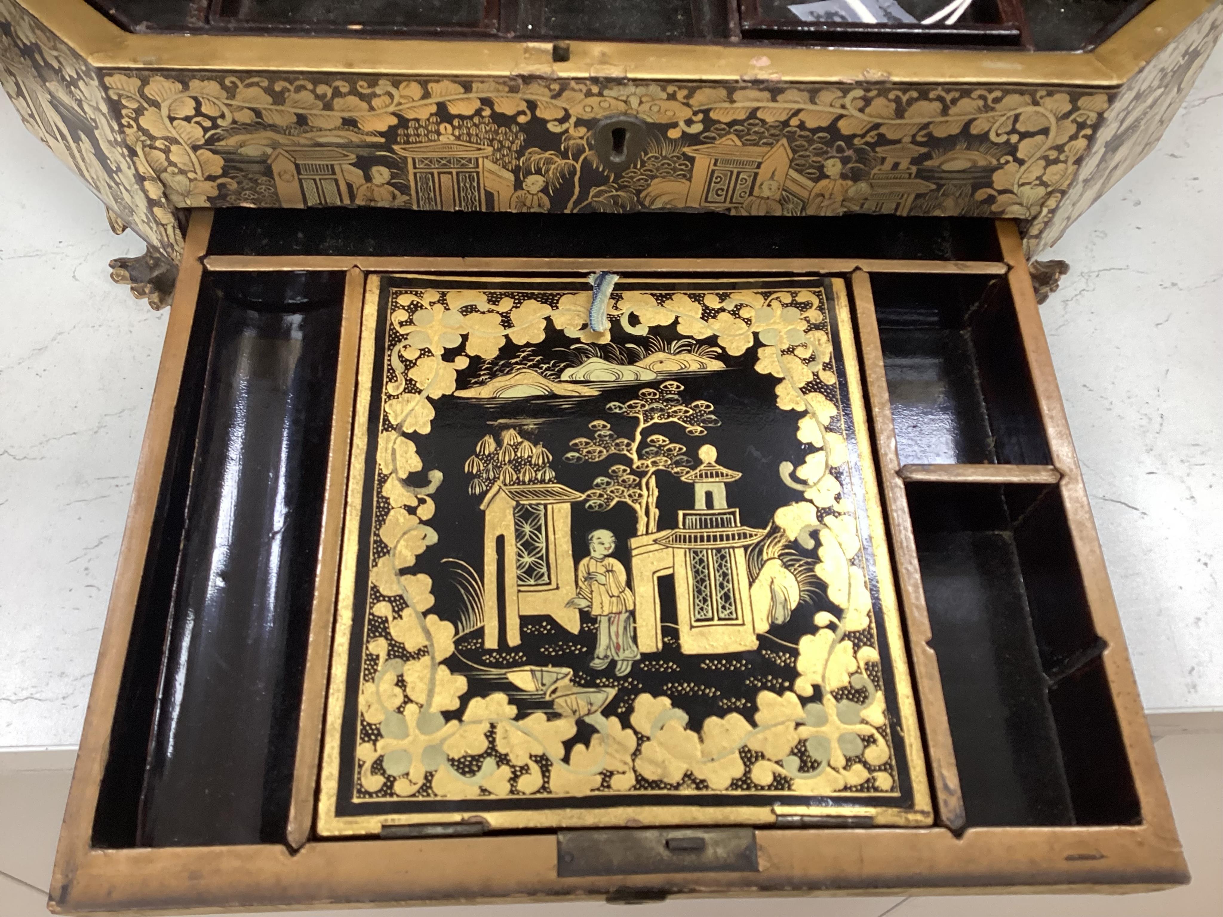 A Chinese export octagonal lacquered work box with fitted interior, 35cm wide